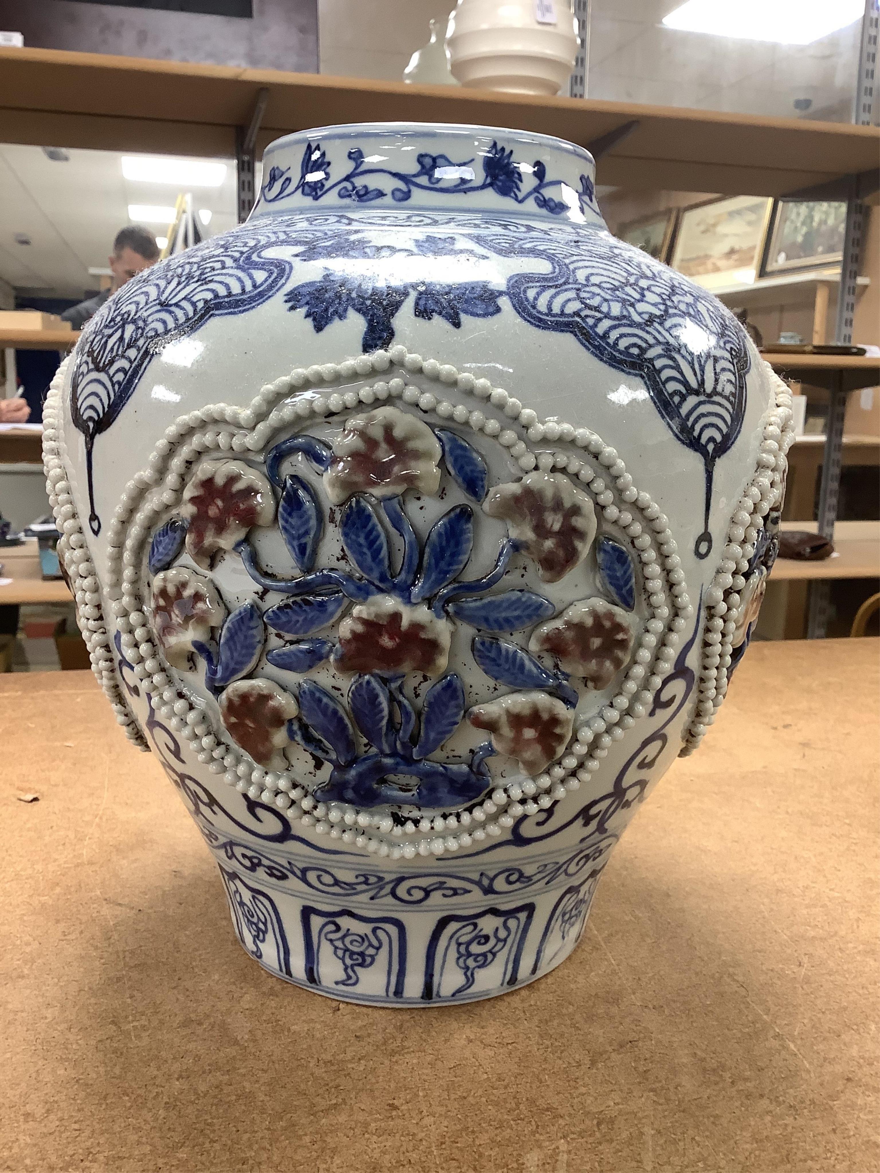 A Chinese underglaze blue and copper red lamp, two crackle glaze vases and a studio pottery bottle, largest 29cm high. Condition - fair
